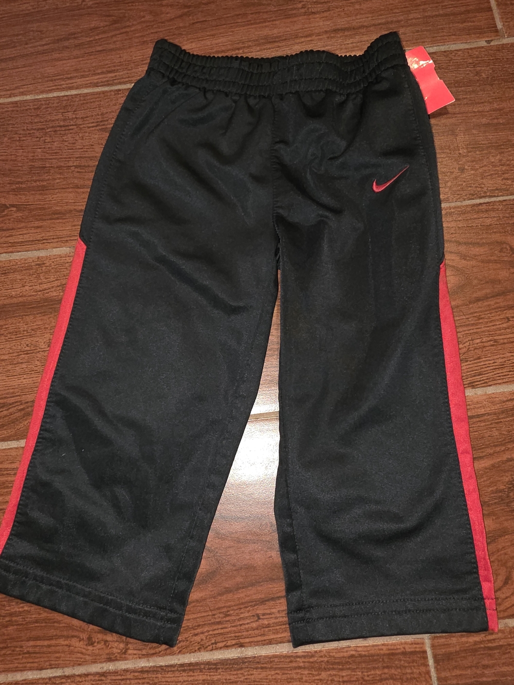 Nike Black Kids Sweatpants with Red Side Stripes